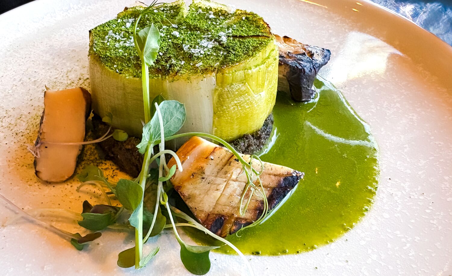Grilled Leek Medallion on Stuffed Mushroom Pate at Juniper Bistro in Banff National Park.